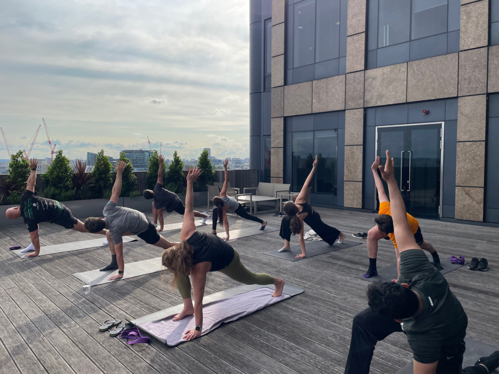 Corporate yoga class on an office terrace in London