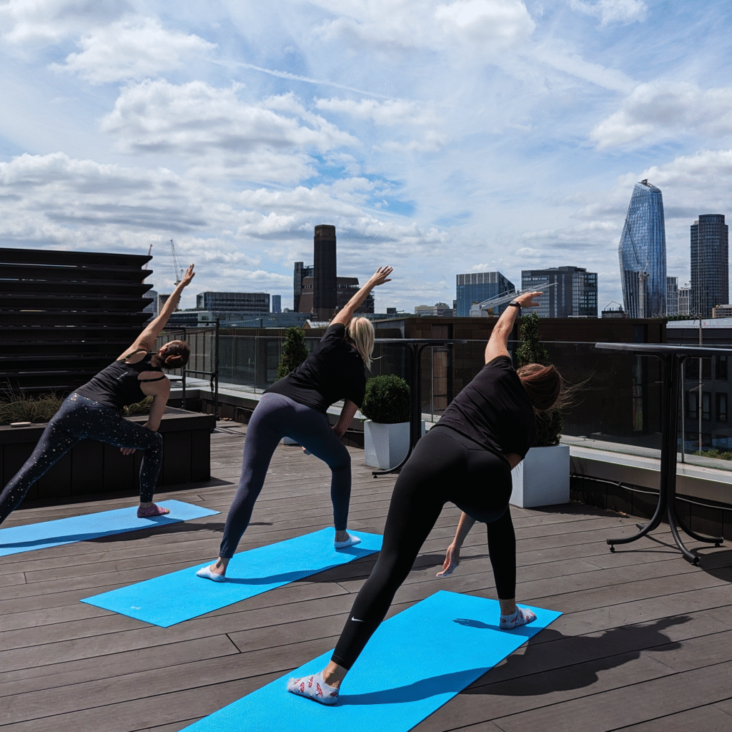 Yoga class on an office terrace overlooking the City of London